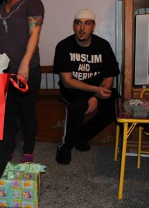 2014 photo of Christopher Young. His t-shirt reads "Muslim and American"